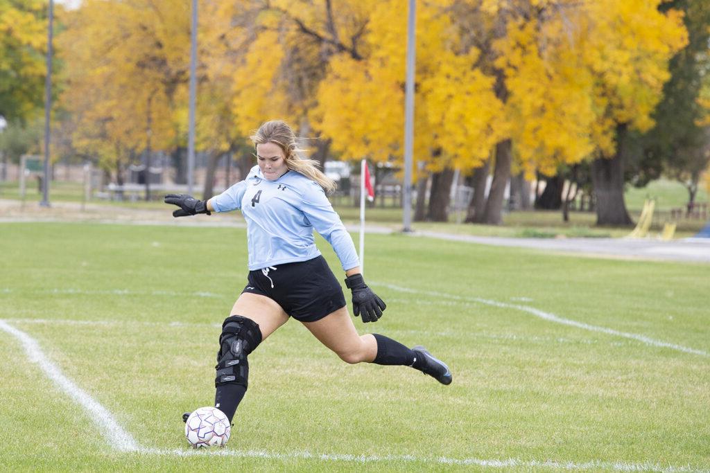 Goalie of the CWC women's soccer team kicks the ball